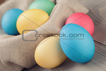 easter eggs in nest from sack textile rustic style