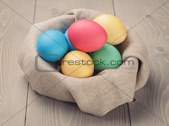 Easter eggs in nest from sack textile rustic style