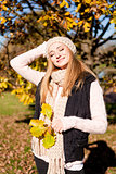 young woman in autumn sunshine outdoor