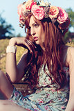 beautfiul woman outdoor in summer with flowers on head