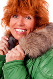 adult redhead woman with winter jacket smiling isolated