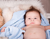 cute little baby todler infant lying on blanket 