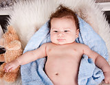 cute little baby todler infant lying on blanket 