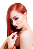 attractive young woman with shiny red hair and makeup