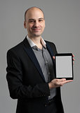 Handsome young man holding a digital tablet