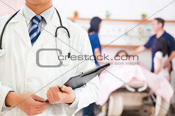  doctor holding a medical history with patient and family
