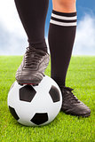 Soccer player's feet  and football with  sky background