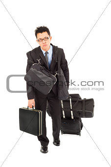 exhausted businessman taking all bags and suitcases 