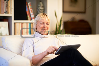 senior woman using touch pad device