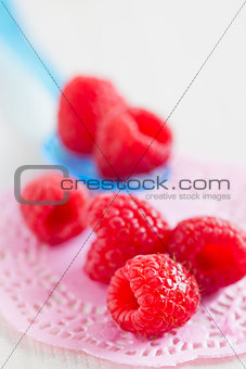 Fresh raspberries and spoon
