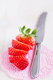 Sliced strawberry and knife