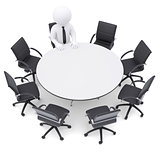 3d man at the round table. Seven empty chairs