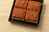 Tiramisu cake with cocoa; selective focus.