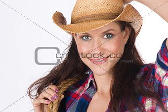 Country Girl Holds Her Gear While adjusting Cowboy Hat