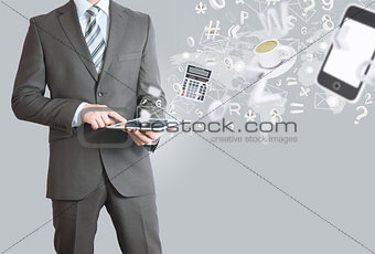 Man in suit holding tablet pc. Office work concept