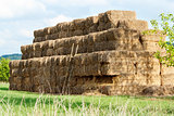 Hay stacks in a field and blue sky 