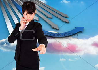 Composite image of thoughtful businesswoman pointing
