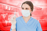 Composite image of pretty brunette female doctor holding a syringe and looking at it