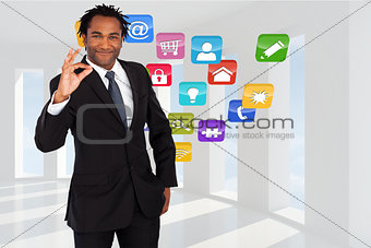 Composite image of businessman showing okay sign