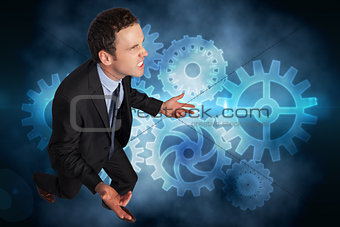Composite image of businessman posing with arms out