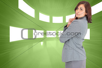 Composite image of concentrating businesswoman