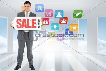 Composite image of businessman with signboard