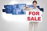 Composite image of estate agent holding and pointing to for sale sign