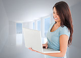 Composite image of good looking woman relaxing with her laptop