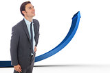Composite image of cheerful businessman standing with hand on hip