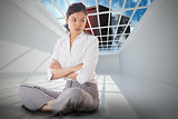 Composite image of annoyed businesswoman sitting with arms crossed