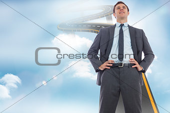 Composite image of happy businessman with hands on hips
