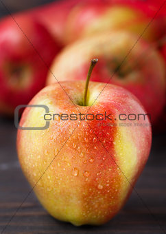 Red apples on wooden table