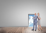 Composite image of serious businessman standing back to back with a woman