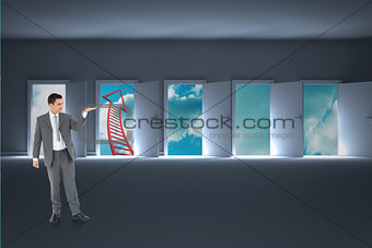 Composite image of businessman looking at what he is presenting