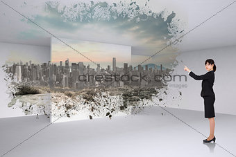 Composite image of serious businesswoman pointing