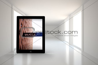 Composite image of wall street on tablet screen