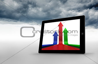 Composite image of arrows on tablet screen