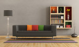 Living room with colorful sofa and bookcase