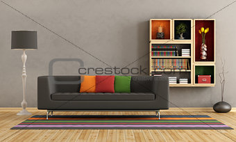 Living room with colorful sofa and bookcase