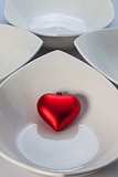 White ceramics bowls and red heart
