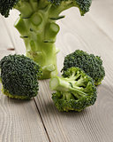 fresh broccoli on wood board