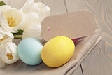 easter eggs with tulips on table