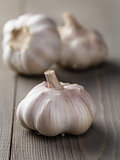 whole garlic on wood table