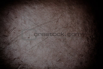 dark grunge scratched leather to use as background