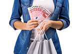 Woman with money and shopping bags