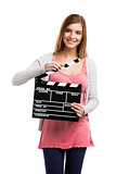 Woman holding clapboard