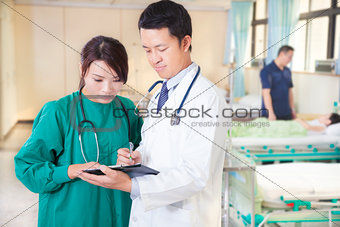 doctor and assistant are discussing  girl situation