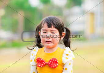 crying little girl in the park