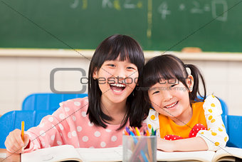 happy little girls in the classroom 