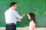 Teacher teach student how to solve the math questions